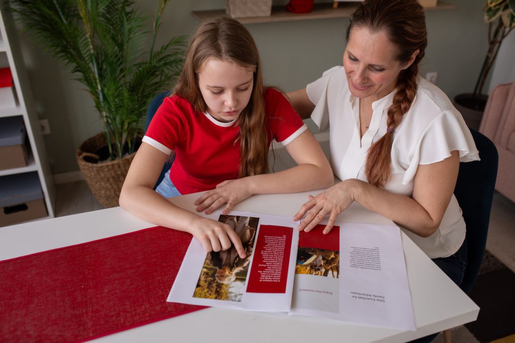 Mother and daughter reading a magazine
