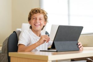 happy pupil using tablet during lesson at school 2025 04 03 03 50 08 utc